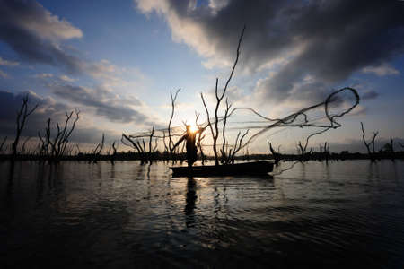 Silhouette fishermanの写真素材