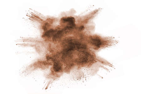 Brown powder explosion isolated on white background.の写真素材