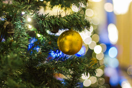 Christmas theme  - New Year 2018 background - ball gold color Abstract Christmas tree with decorations bokeh light blur background with bokeh backgroundの写真素材