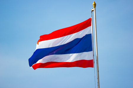 The flag of Thailand with blue sky background.の写真素材