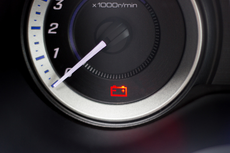 Screen symbols battery warning light in-car dashboardの写真素材