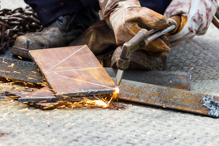 Worker cuts steel with gas -  Plasma Cutting Machine on Steel Plate
