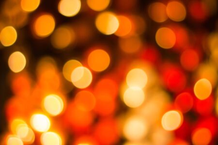 bokeh Decorative outdoor string lights hanging on the tree in the garden at night timeの写真素材