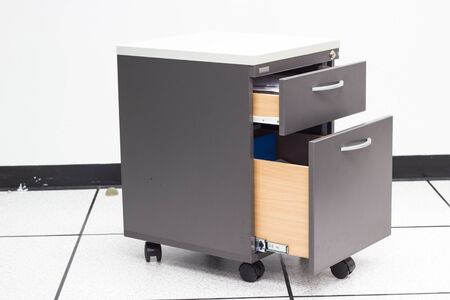 blue file folder documents In a file cabinet retention of contracts - concept business office equipmentの写真素材