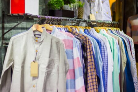 man clothes multi color  on hangers in park outdoor Thailand