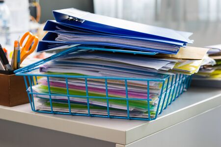 File folder and Stack of business report paper file on the table in a work officeの写真素材