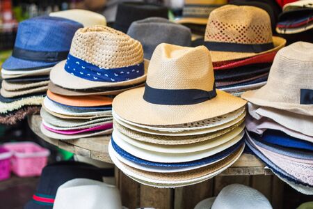 Many women's Beautiful hats for ladies for sale at market Thailandの写真素材