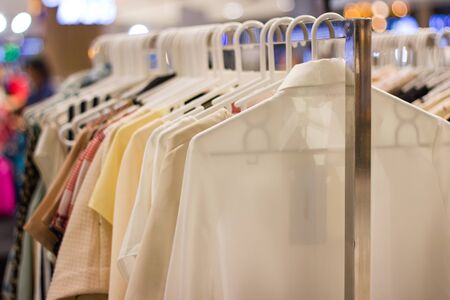 woman clothes on a hanger in department store for sale in market  Bangkok Thailandの写真素材