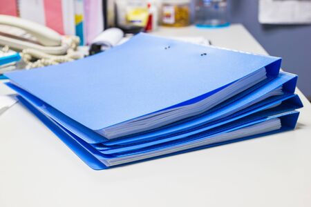 file folder and Stack of business report paper file on the table in a work officeの写真素材