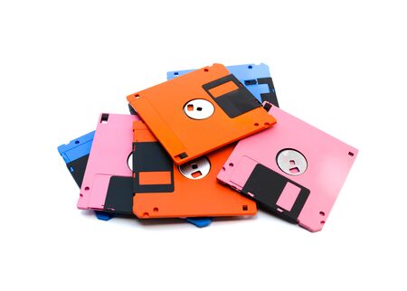 A floppy disk also called a floppy, diskette, or just disk was a ubiquitous form of data storage and exchange from the mid-1970s into the mid-2000s. isolated on white backgroundの写真素材