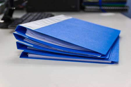 file folder and Stack of business report paper file  on desk in office, business concept.の写真素材