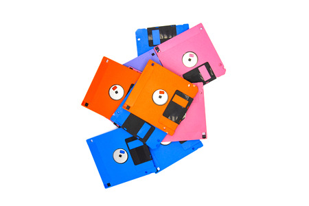 A floppy disk also called a floppy, diskette, or just disk was a ubiquitous form of data storage and exchange from the mid-1970s into the mid-2000s. isolated on white backgroundの写真素材