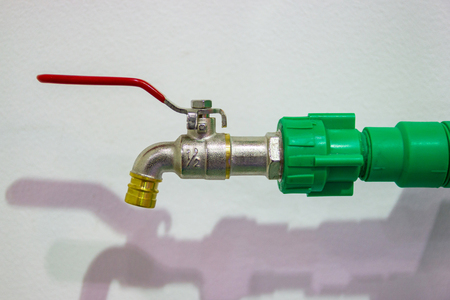 Blue faucet and Green Pipes installed at homeの写真素材