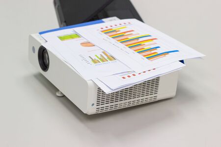 preparation for the projector meeting, and photo sheets,  charts concept business office expenses.