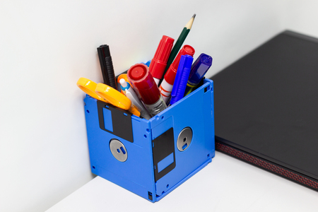 recycle floppy disk, Creative objects used for Store supplies such as pen pencils Scissors in a box on the table in work office, concept recycle floppy diskの写真素材
