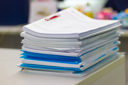 file folder and Stack of business report paper file on the table in a work office, concept document in work officeの写真素材