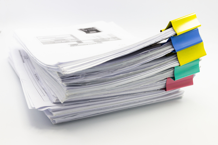 Stack of papers documents in archives files with paper clipsの写真素材