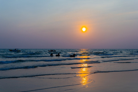 people playing on the beach during sunset and Silhouetteの写真素材