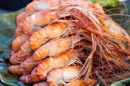 Grilled shrimps of seafood Street food of Thailand on the table in market of Bangkok Thailandの写真素材