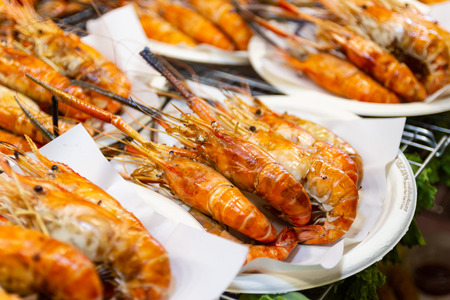 Grilled shrimps seafood on the table in market of Bangkok Thailandの写真素材