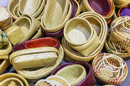 Community Products Weaving A Wicker Basket basketry, fruit basket products By Handmade, in a market of Thailandの写真素材