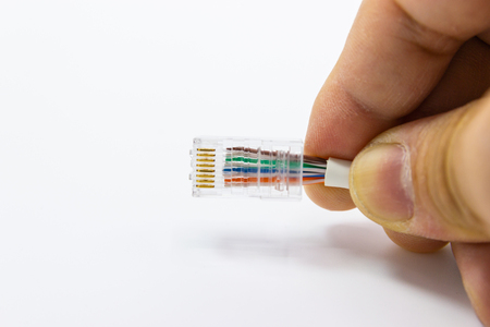 hand of man hold RJ45 with Cable for use Network internet cable, concept network cable connectivity...