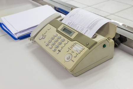 The fax machine for Sending documents in the office concept equipment needed in officeの写真素材