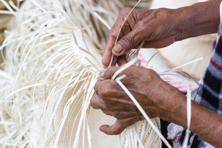 The villagers took bamboo stripes to weave into different forms for daily use utensils of the community people in Bangkok Thailand, Thai handmade product.の写真素材