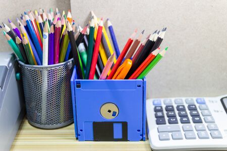 recycle floppy disk, Creative objects used for Store supplies such as pen pencils Scissors in a box on the table in work office, concept recycle floppy diskの写真素材