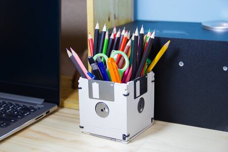 recycle floppy disk, Creative objects used for Store supplies such as pen pencils Scissors in a box on the table in work office, concept recycle floppy diskの写真素材