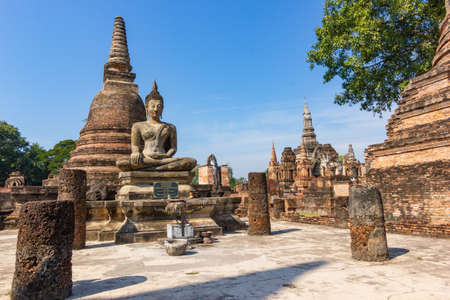The old buddha image on cement with ruins and ancientの写真素材
