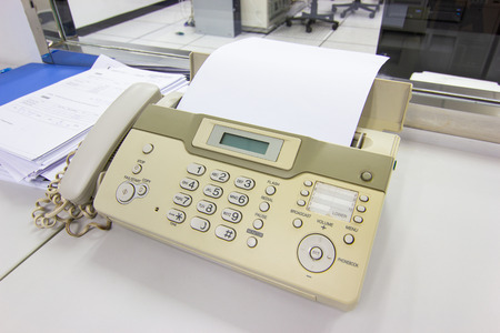 The fax machine for Sending documents in the office concept equipment needed in officeの写真素材