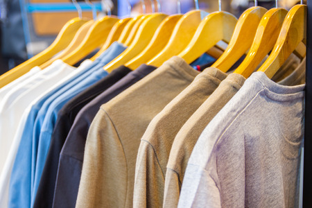 Colorful t-shirt on hangers for sale in department stores.の写真素材