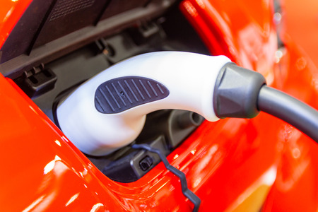 the charging the battery for the car new Automotive Innovations the power supply plugged into an electric car being charged, concept of energy innovation.の写真素材