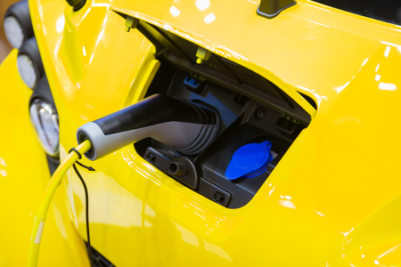 the charging the battery for the car new Automotive Innovations the power supply plugged into an electric car being charged, concept of energy innovation.の写真素材