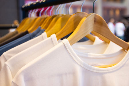 Colorful t-shirt on hangers for sale in department stores.の写真素材
