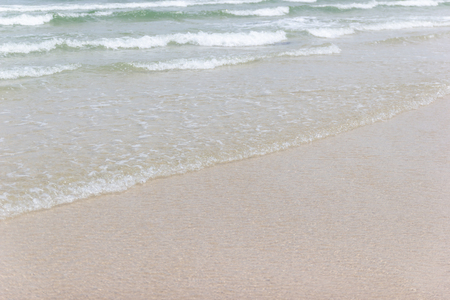 Close up detail of the sea waves washing ashore at the beach Asia Thailandの写真素材