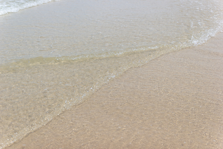 Close up detail of the sea waves washing ashore at the beach Asia Thailandの写真素材