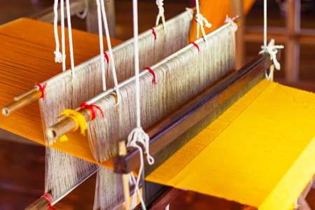 Weaving equipment Household weaving - Detail of weaving loom for homemade silk Used for silk weaving or textile production of Thailandの写真素材