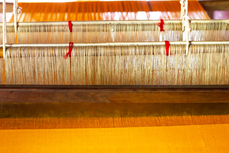 Weaving equipment Household weaving - Detail of weaving loom for homemade silk Used for silk weaving or textile production of Thailandの写真素材