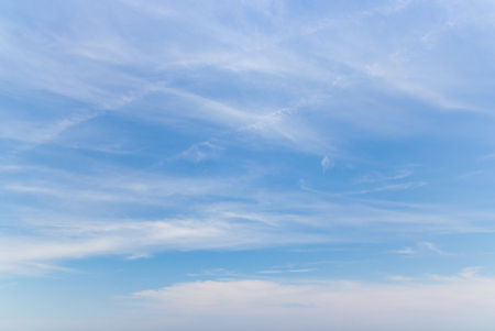 Transparent blue sky with clouds and atmospheric afternoon.の写真素材