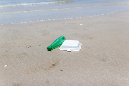 garbage and plastic bottles, foam and dirty waste on a beach Asia Thailand, environmental protection...
