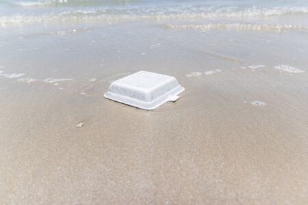 garbage foam and dirty waste on a beach Asia Thailand.の写真素材
