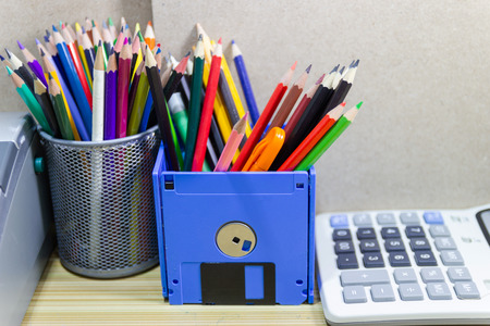 recycle floppy disk, Creative objects used for Store supplies such as pen pencils Scissors in a box on the table in work office, concept recycle floppy diskの写真素材