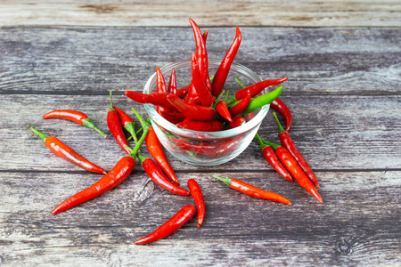 Chili - The pepper plants to the nature of the sphere of the long spikes on woodの写真素材