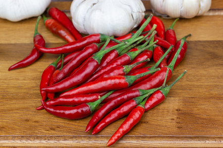 Chili - The pepper plants to the nature of the sphere of the long spikes on woodの写真素材
