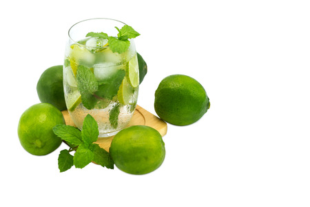 mojito cocktail with lime and mint in glass for hot summer days and good for health isolated white copy spaceの写真素材