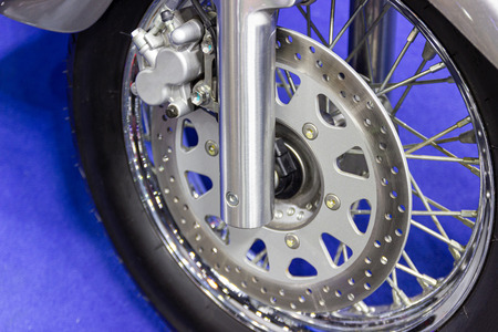 close up - wheel spokes and brake disc of a motorcycle