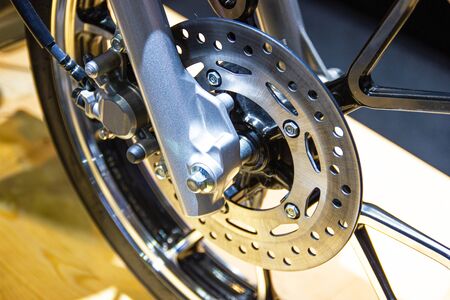 close up - wheel spokes and brake disc of a motorcycleの写真素材