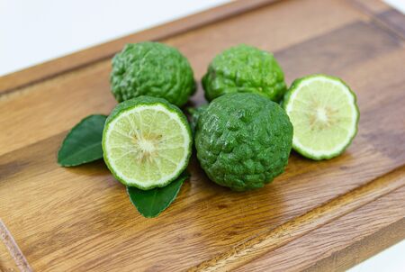 fresh fruits bergamot with cut in half on wood table.の写真素材